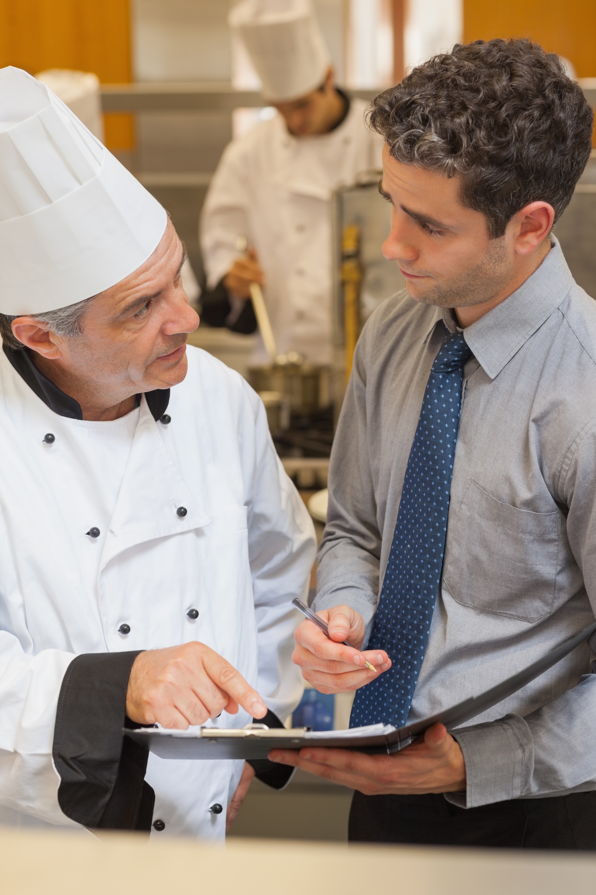 Consultation meeting with chef and client documents